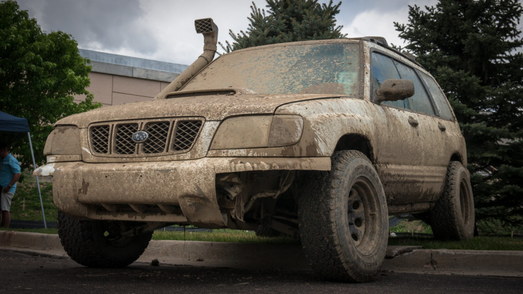 Muddy subaru forester with all terrain tires