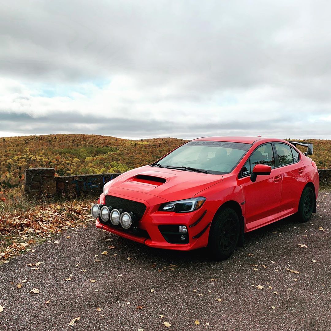 Red lifted subaru wrx with lift kit and rally lights