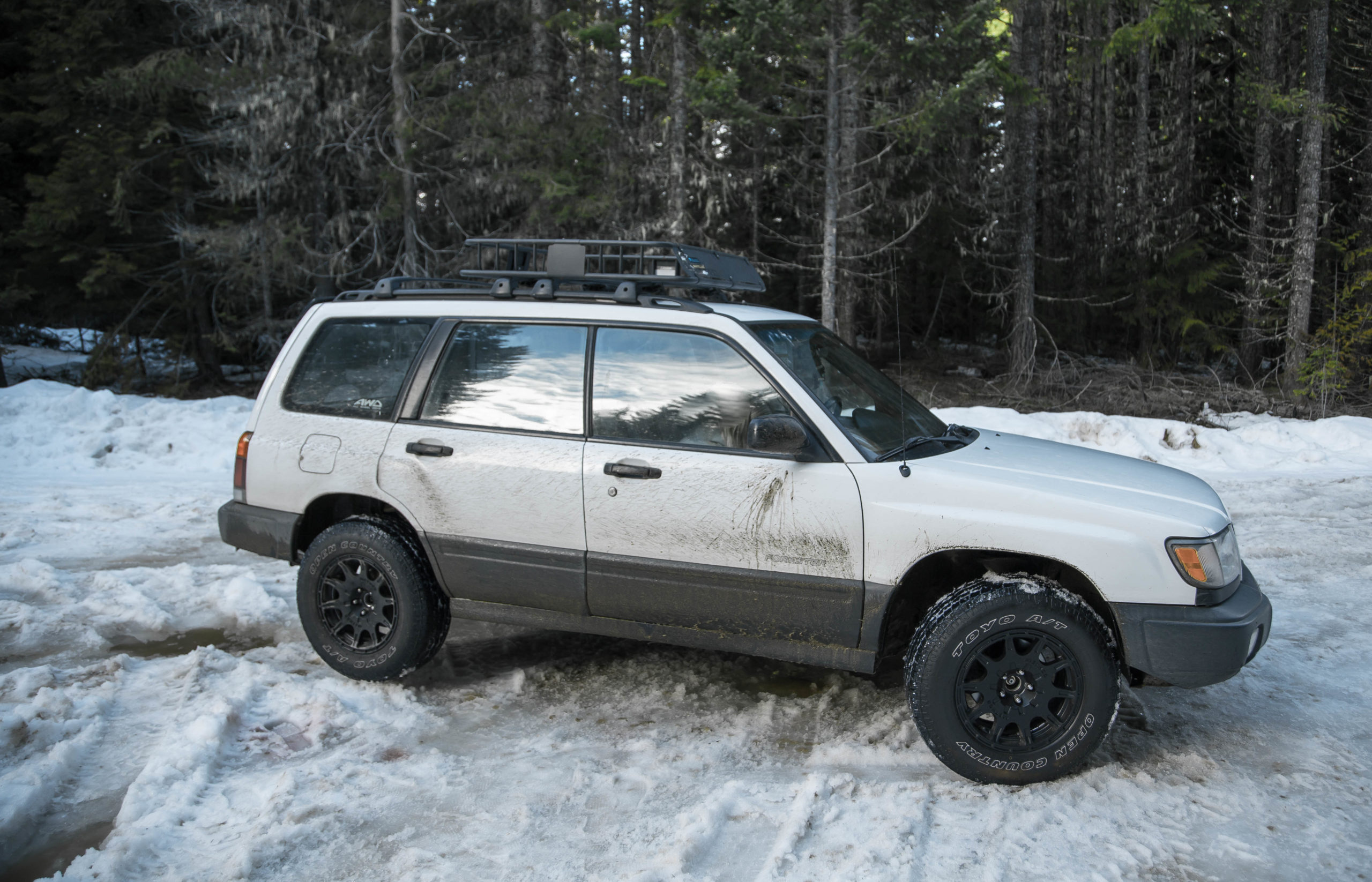 Lifted Subaru Forester in the snow with off road tires