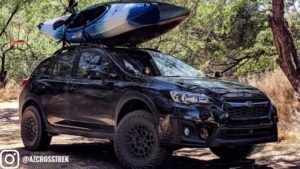 Subaru crosstrek with roof basket and lift kit