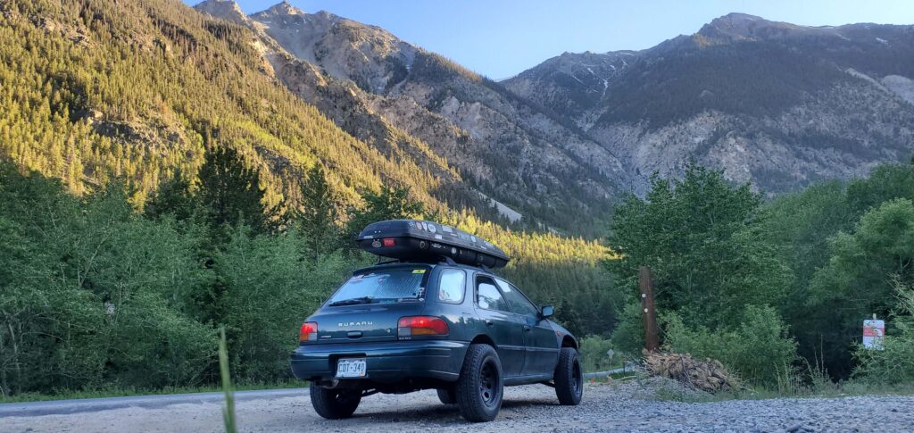 lifted subaru impreza with off road tires and roof rack 1