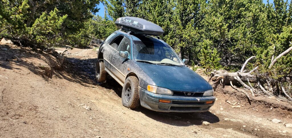lifted subaru impreza with off road tires and roof rack 5