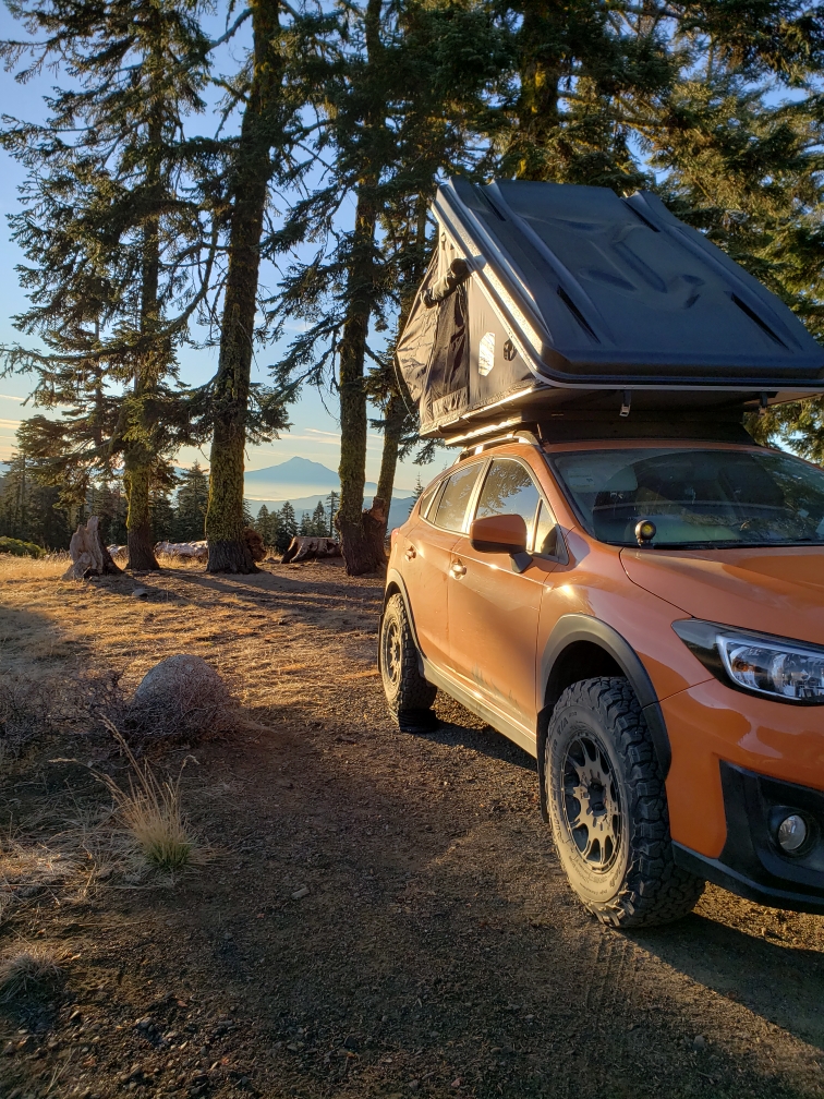 off road subaru crosstrek in the woods with method racing wheels