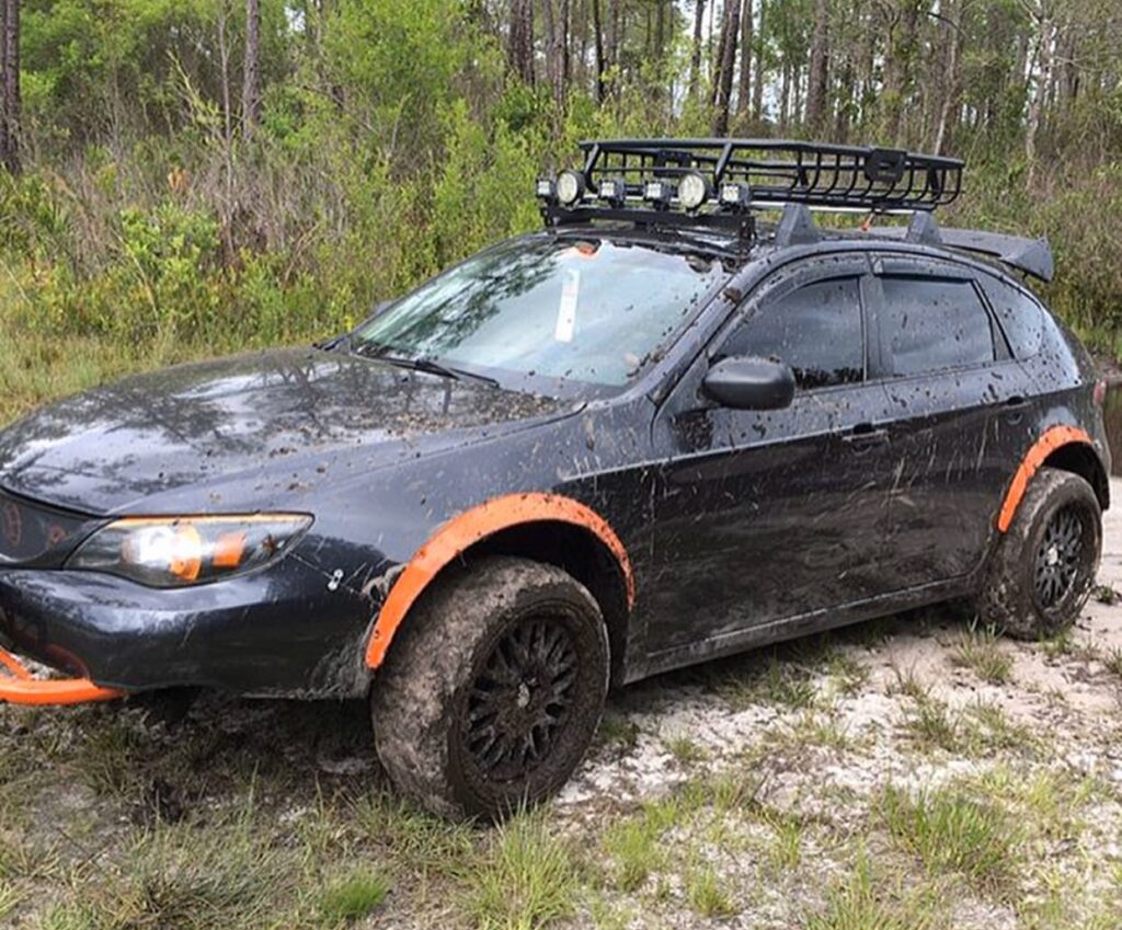 Subaru Impreza with lift kit installed and offroad tires