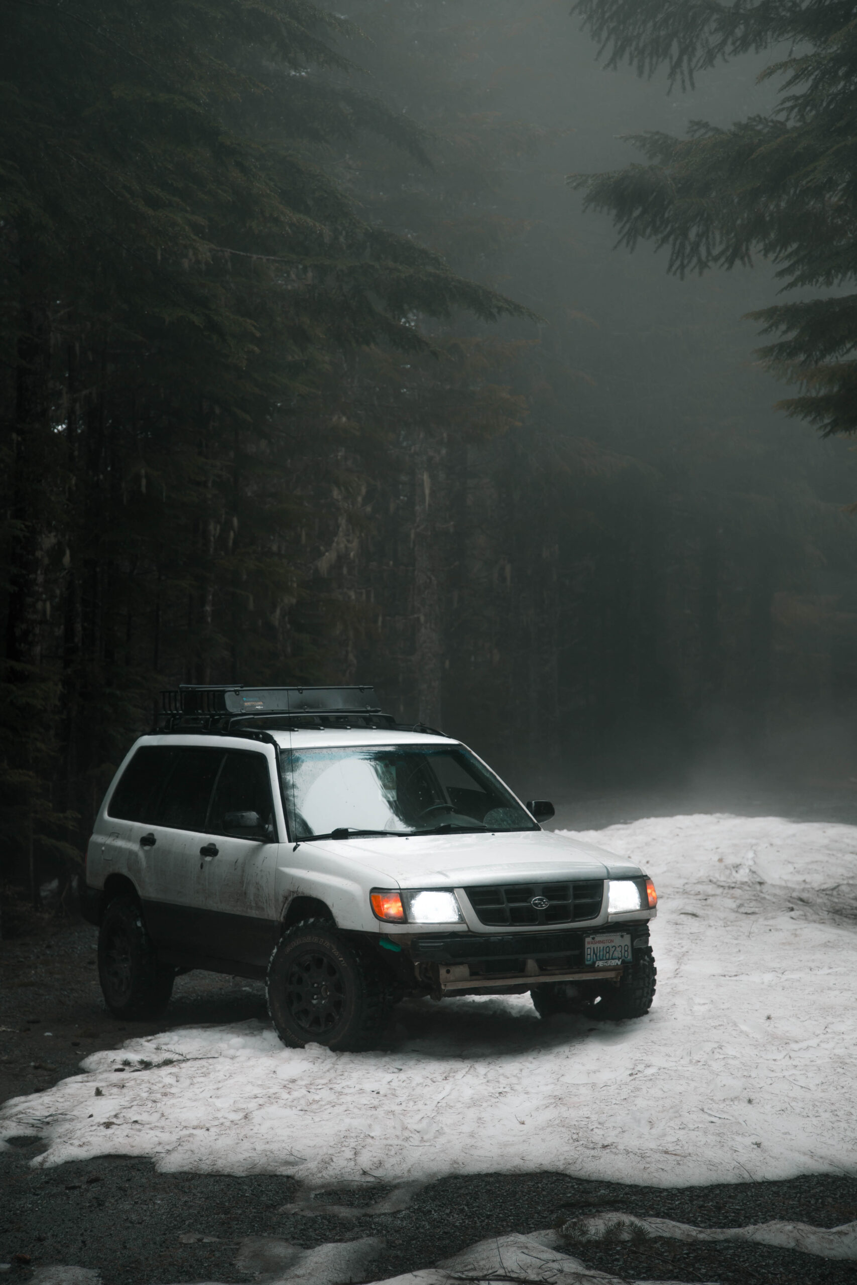 Lifted 2000 subaru forester with federal couragia mt tires in the snow on method wheels