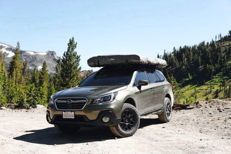Lifted subaru outback with KMC Bully wheels and all terrain tires