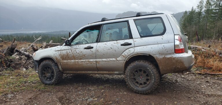 lifted subaru forester with mud tires and fender flares