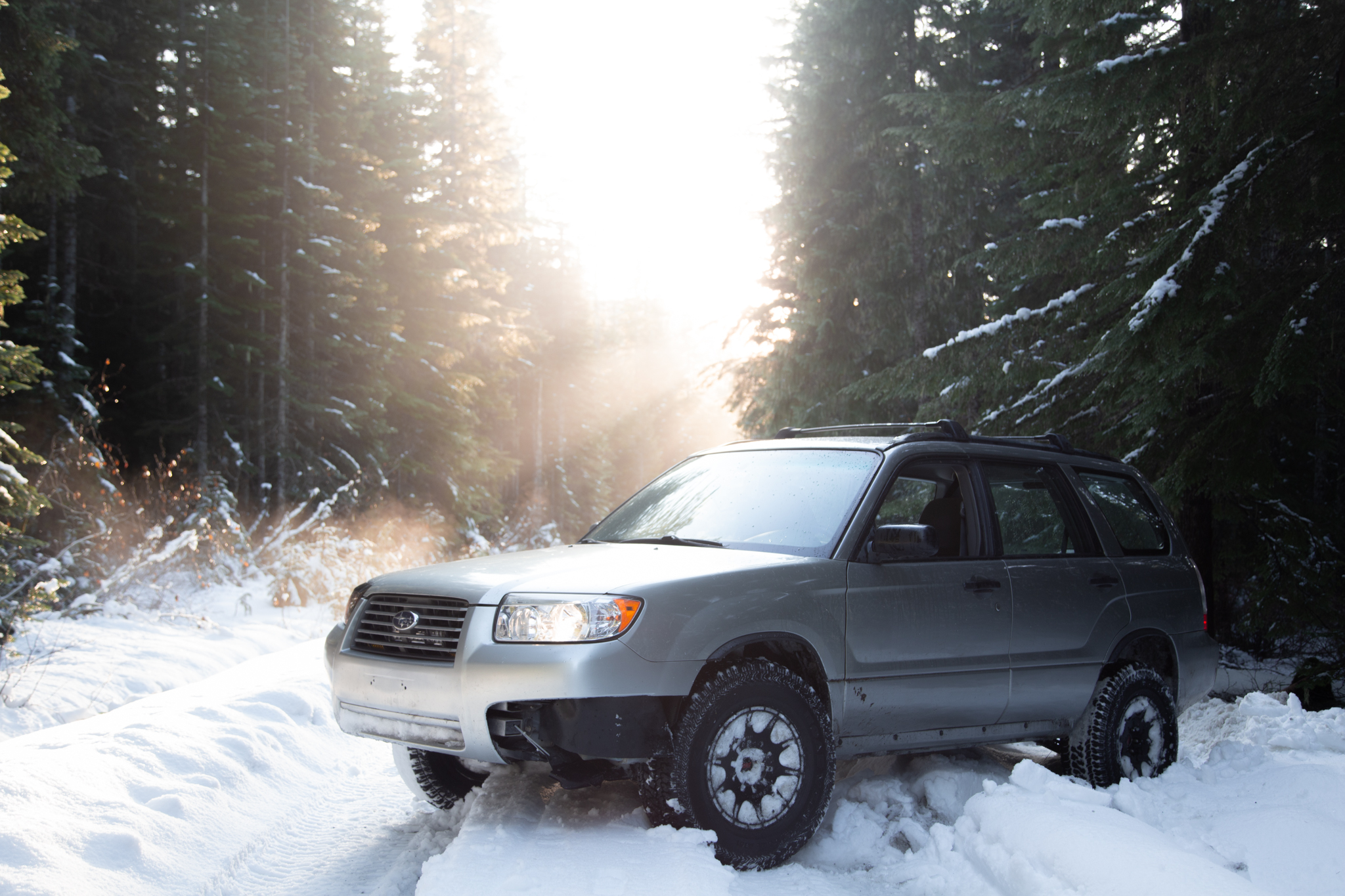 lifted subaru forester with all terrain tires and method mr502 wheels