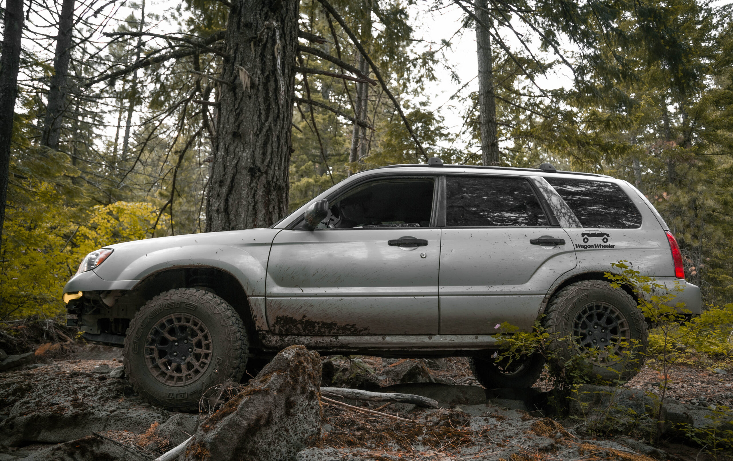 lifted silver 2006 subaru forester offroad