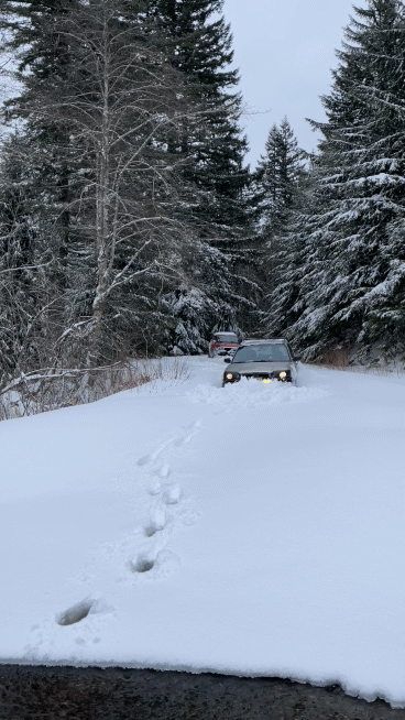 lifted forester plows through deep snow