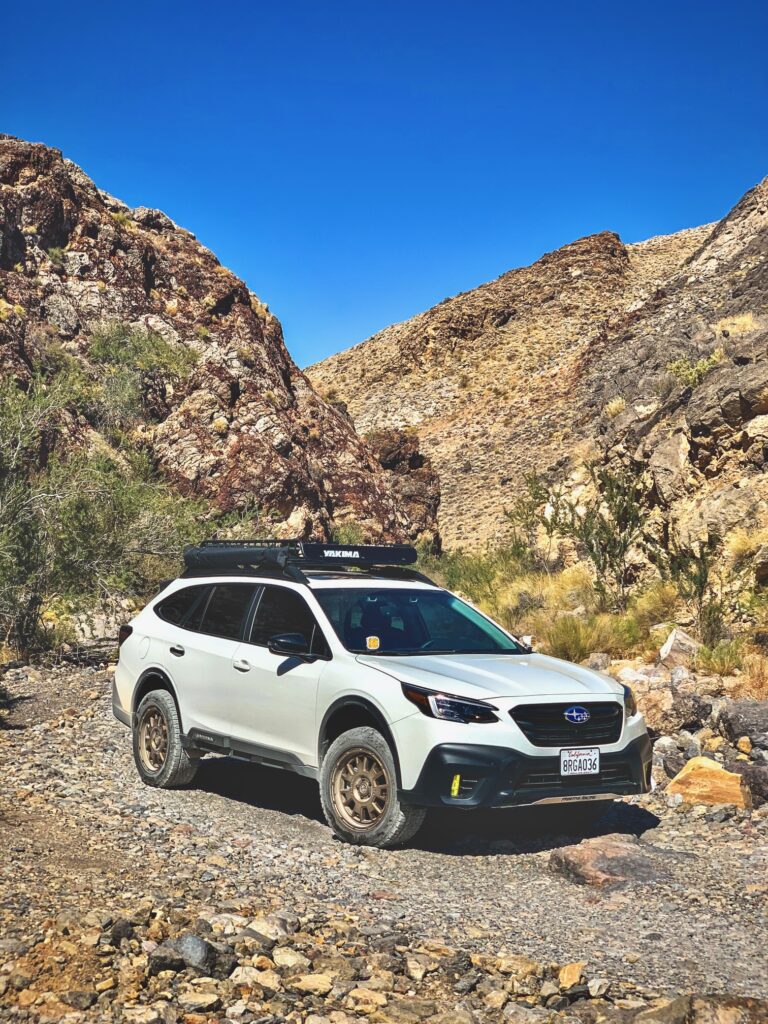 lifted subaru outback xt in the desert with offroad tires
