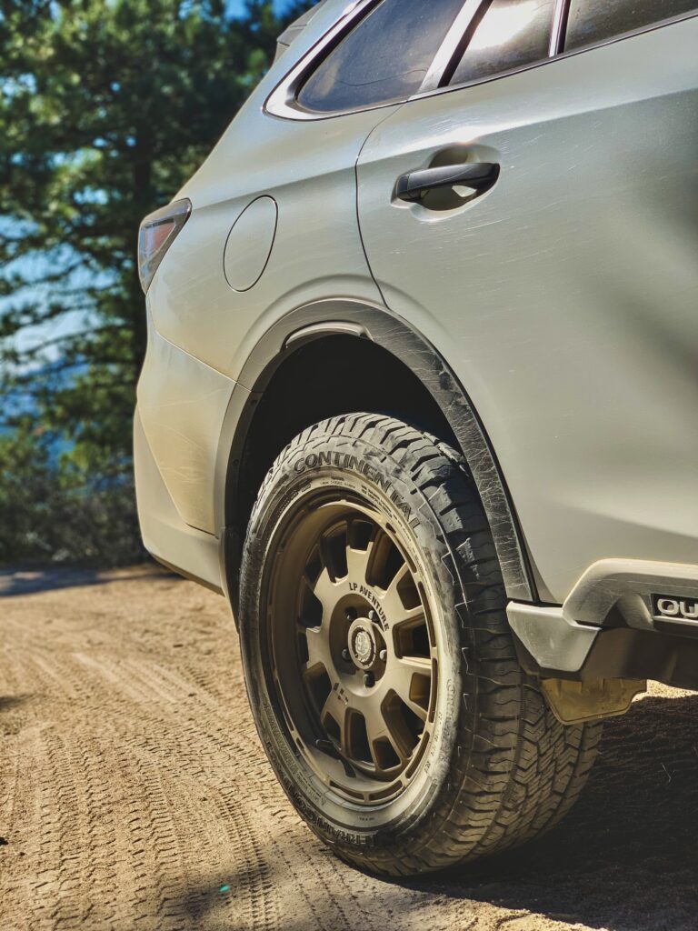 lifted subaru outback with offroad tires and wheels