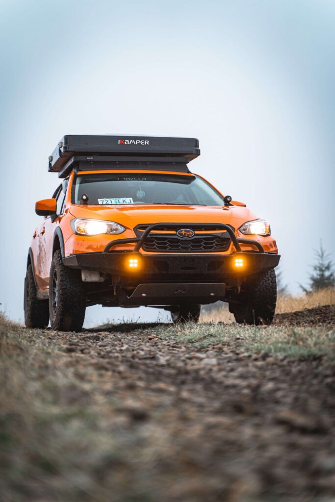 Subaru crosstrek with LP aventure lift kit and off road tires and method wheels
