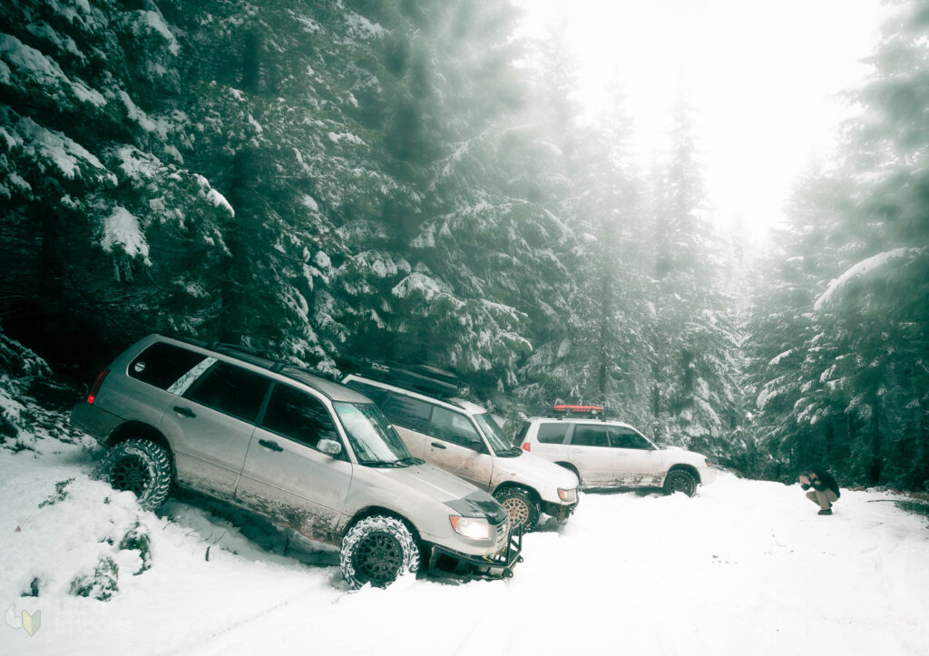 lifted subarus in the forest with snow tires and offroad tires