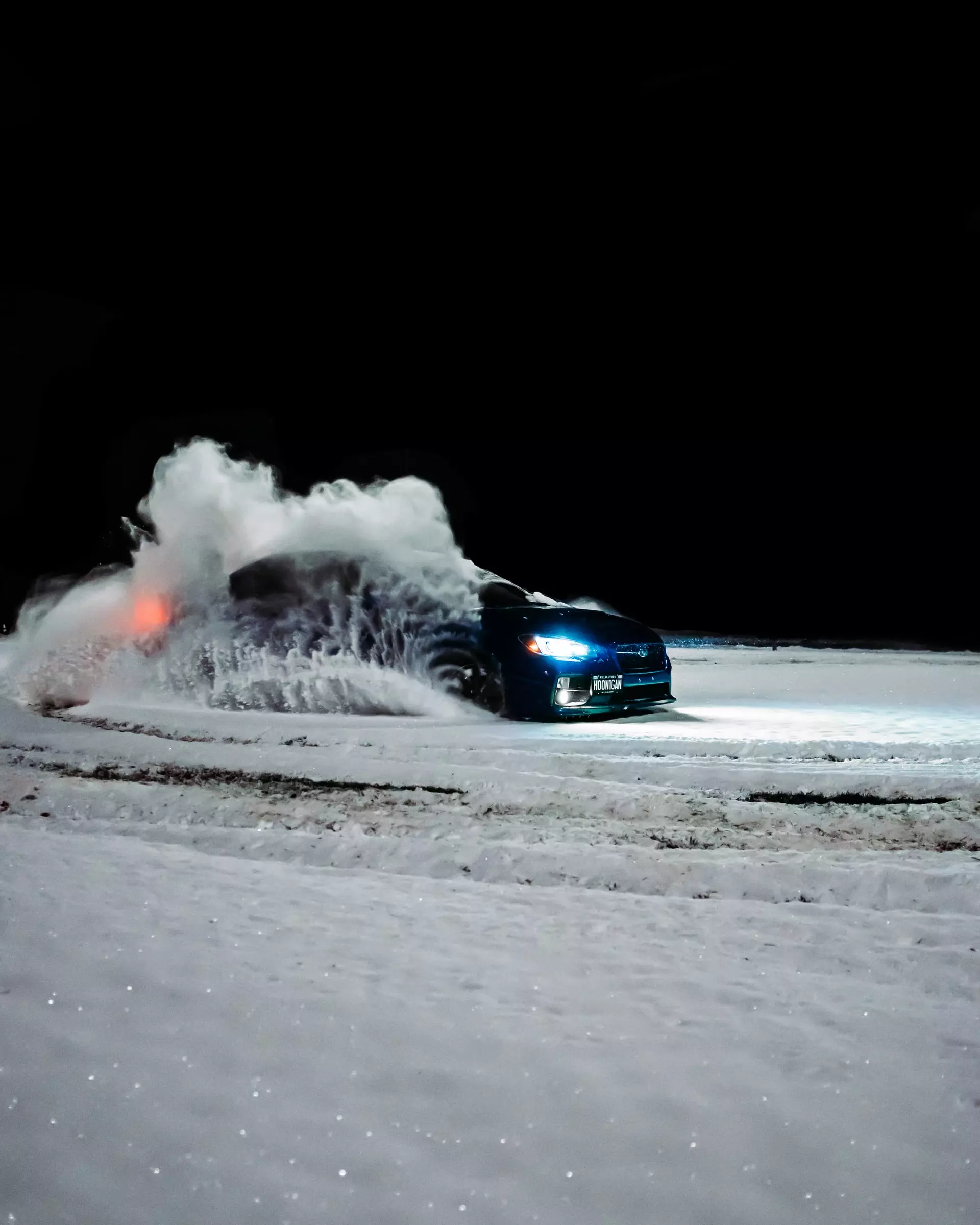 subaru wrx in the snow with snow tires