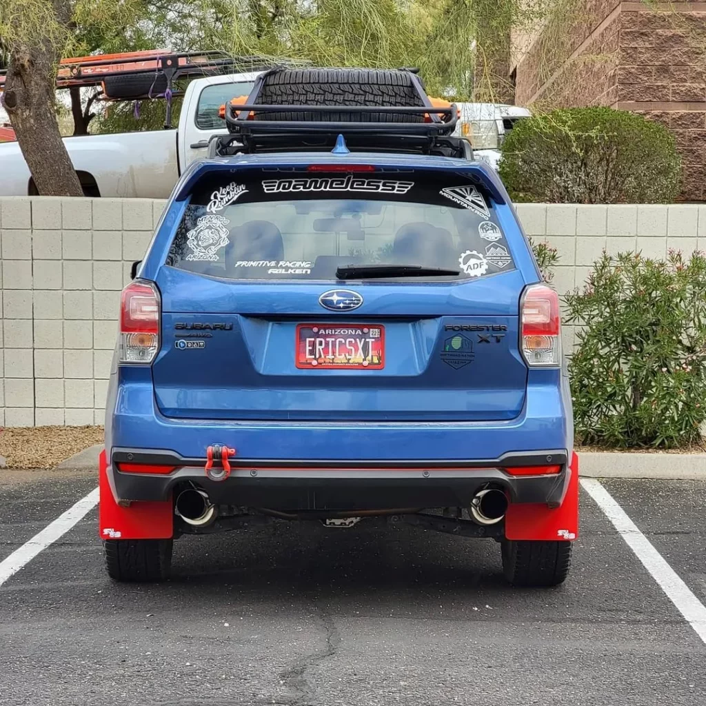 blue lifted forester xt 2017 with roof rack and mud flaps