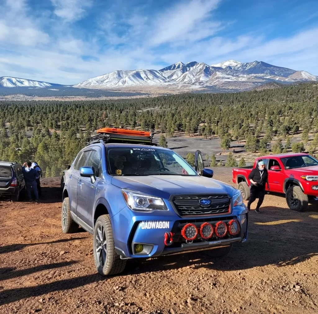 blue lifted forester xt 2017 with roof rack with other rigs