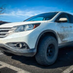 white honda crv 2014 with bfg ko2 offroad tires and a lift kit front end