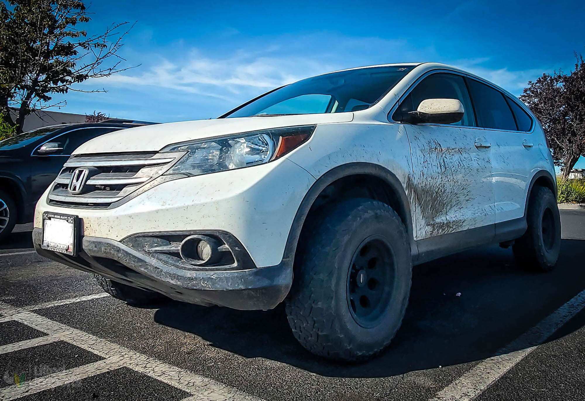 white honda crv 2014 with bfg ko2 offroad tires and a lift kit front end
