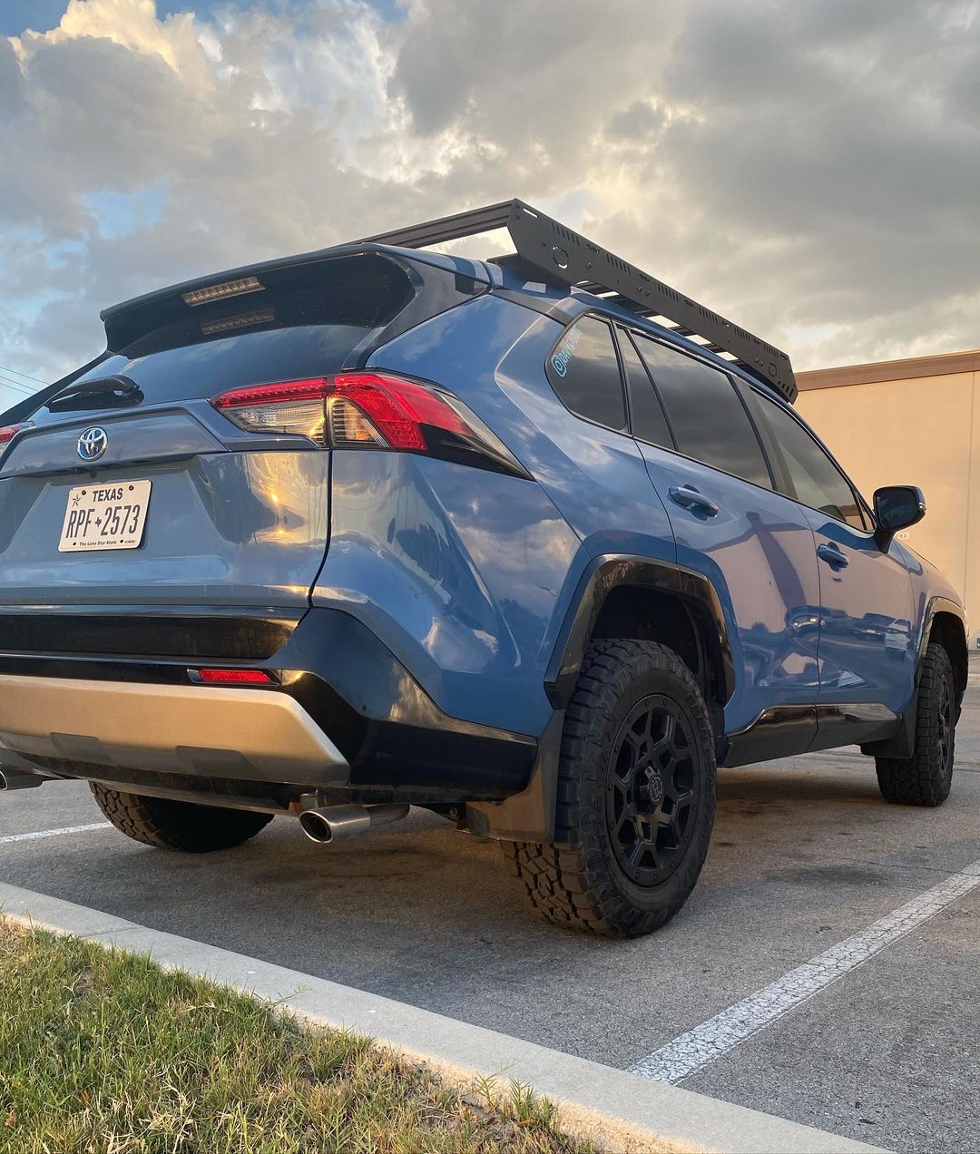 blue 2022 toyota rav4 with lift kit