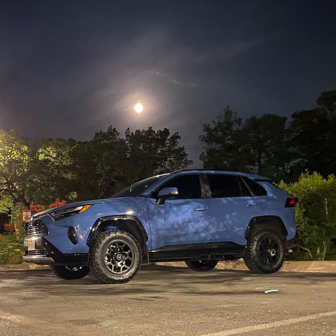 lifted rav4 2022 hybrid with offroad wheels and tires and readylift lift kit