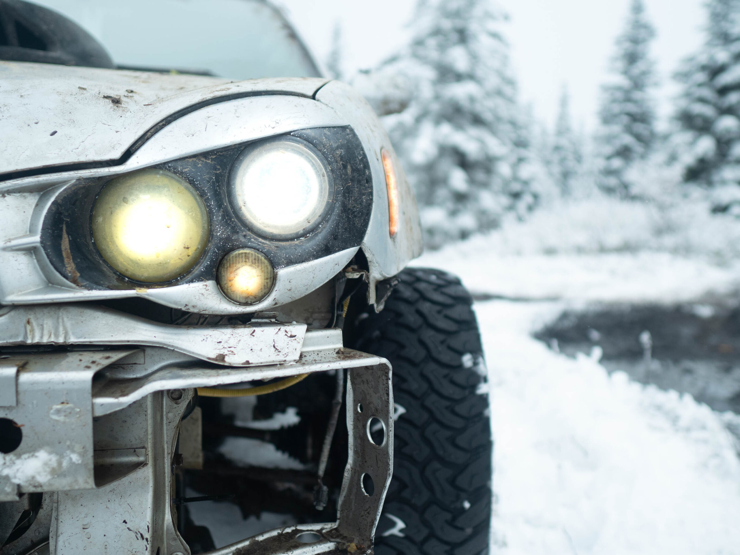 lifted subaru wrx offroad in snow with JDM headlights