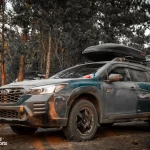 subaru outback wilderness with offroad tires