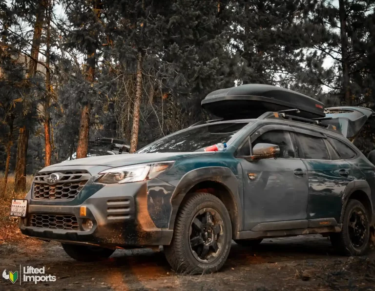 subaru outback wilderness with offroad tires