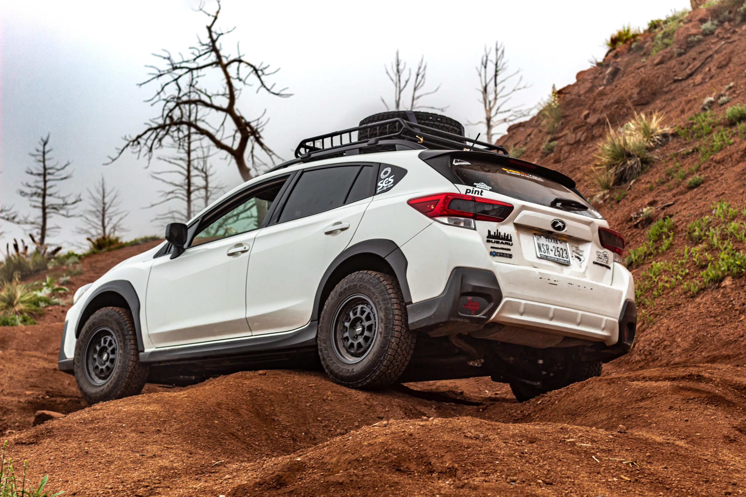 crosstrek in sandy 4x4 trail with roof rack