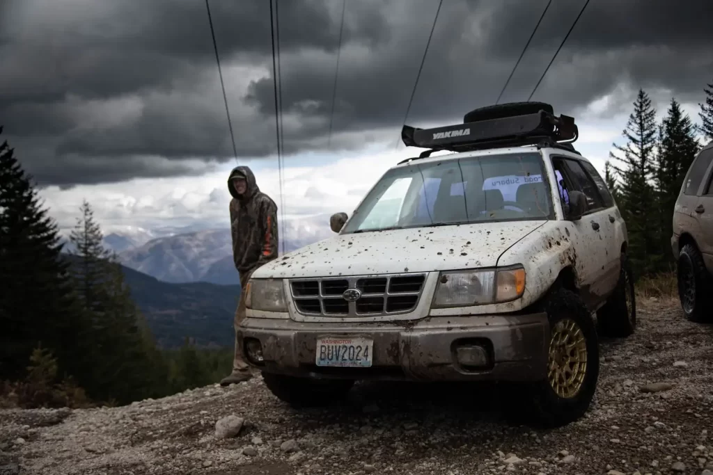lifted-subaru-forester-offroad-with-a-rooftop-mounted-spare-tire-