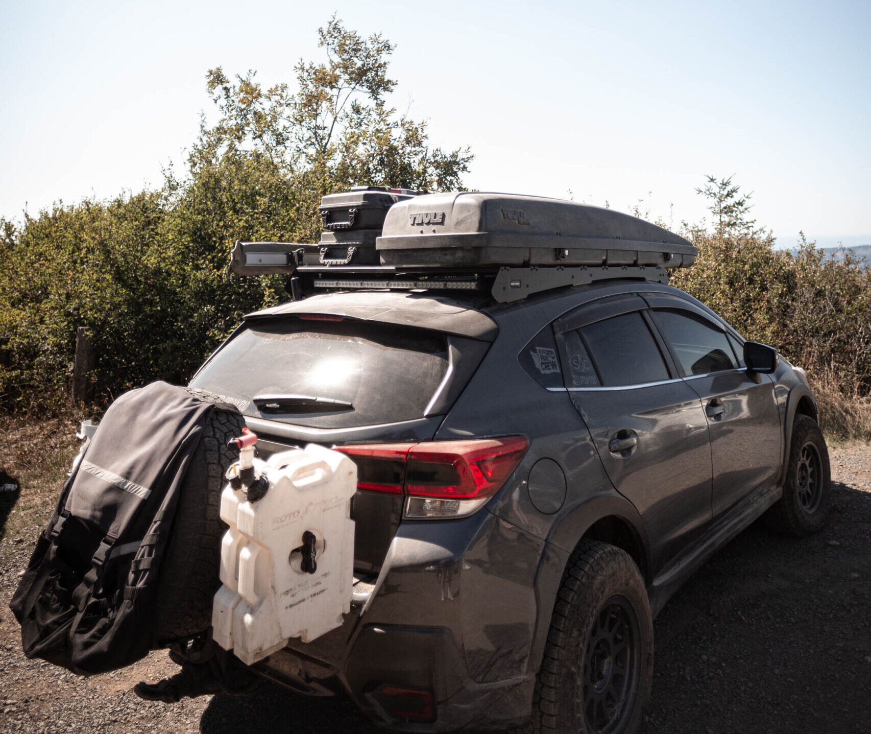 subaru crosstrek with a rear tire carrier for offroad