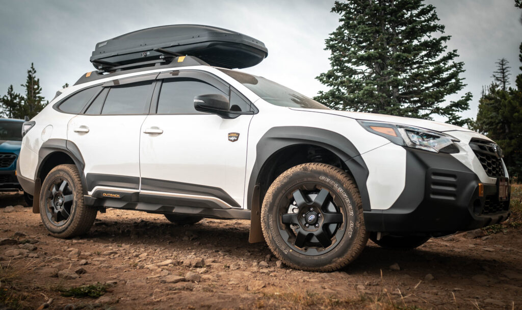 white subaru outback wilderness edition with yokohama geolandar tires