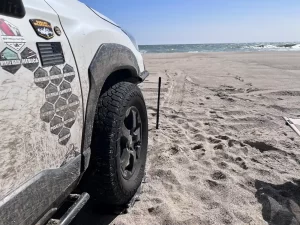 lifted subaru forester in the sand with kumho at52 tires