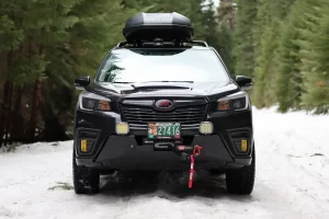 2021 Subaru forester offroad in the snow with warn winch and bumper offroad