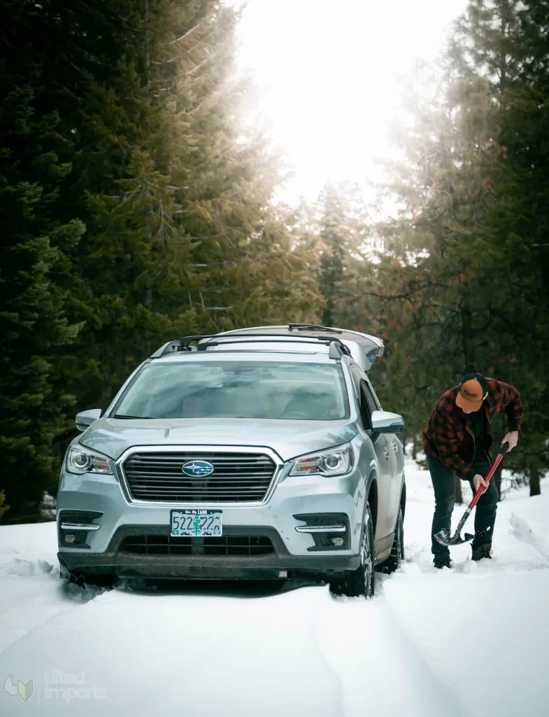 lifted subaru ascent in the snow stuck