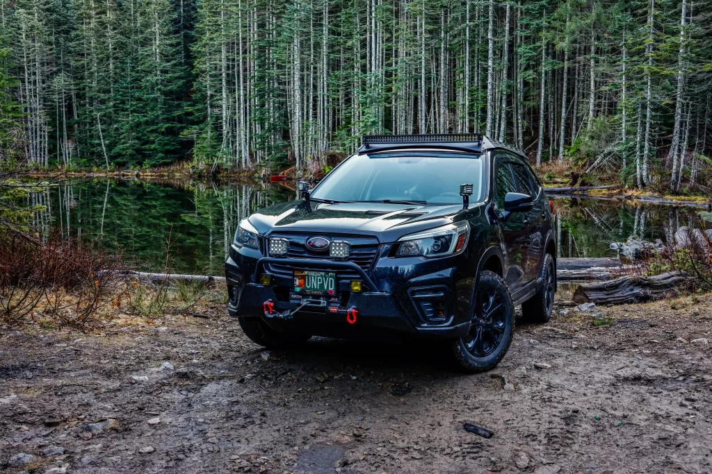 offroad modified subaru forester in the woods