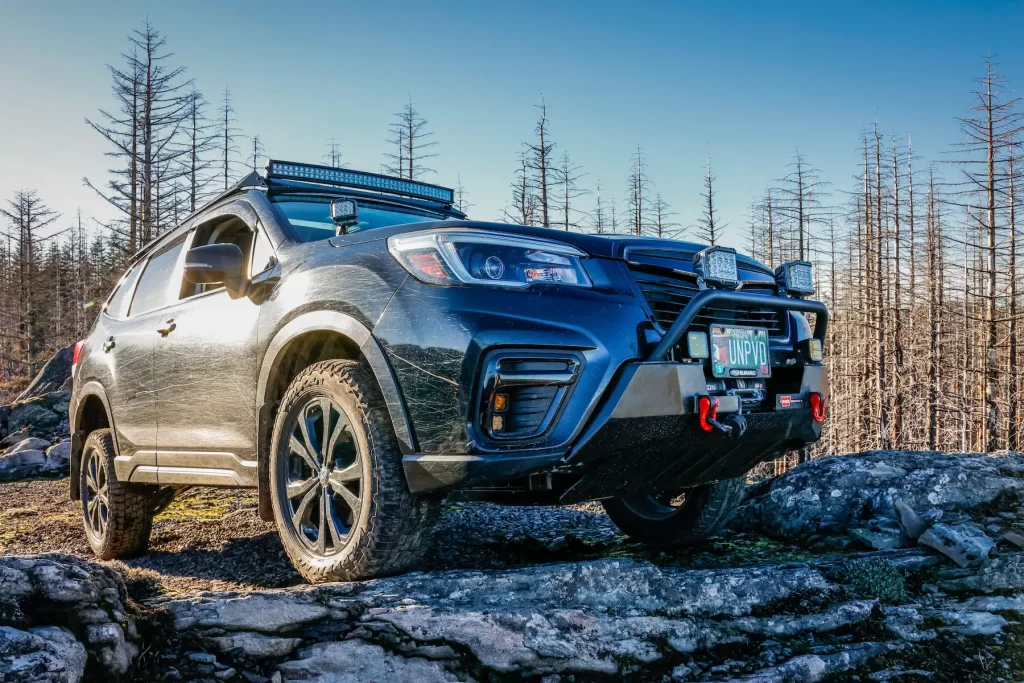 offroad modified subaru forester on rocks