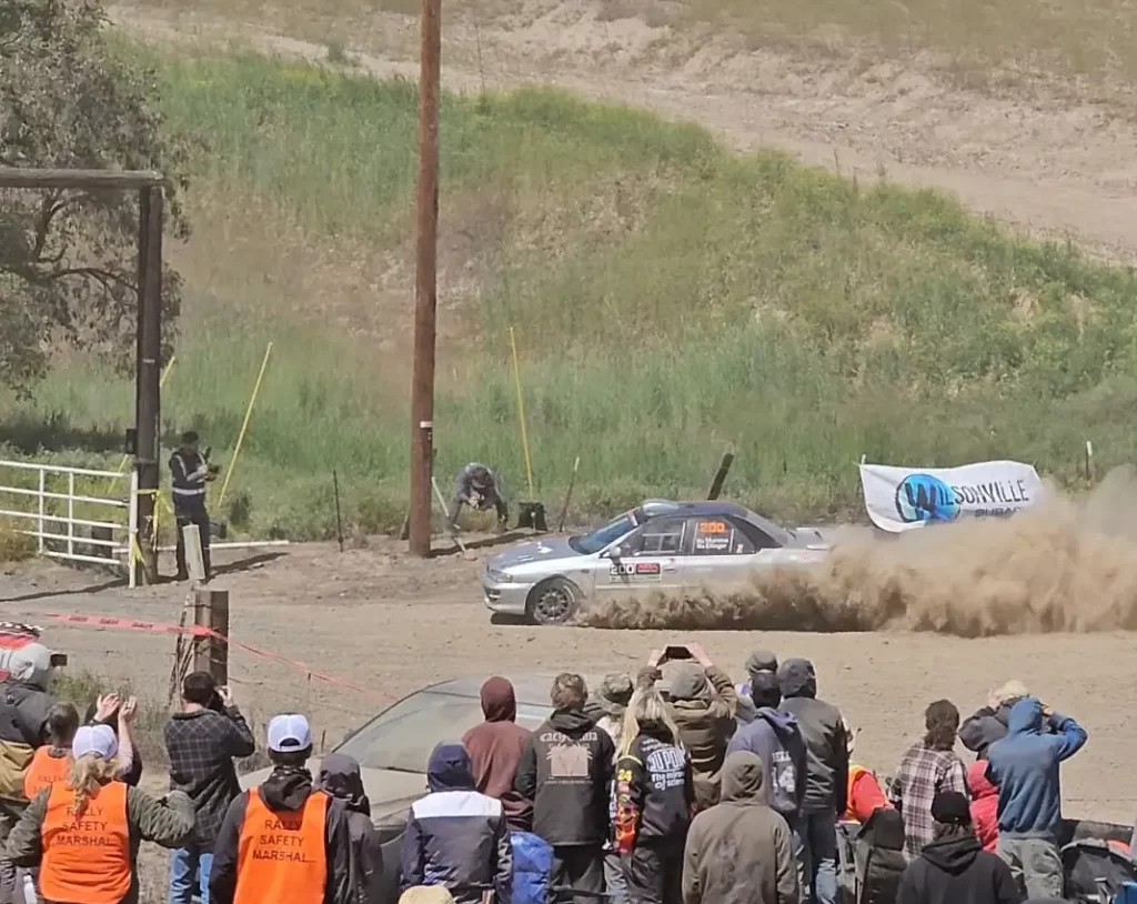 subaru rally car kicking up dirt