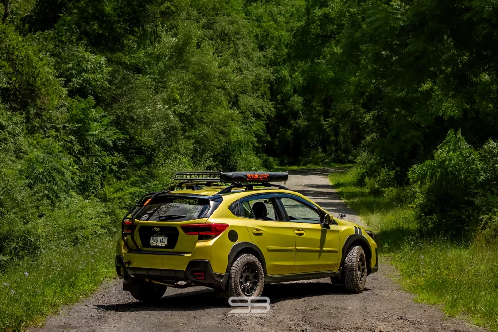 green subaru crosstrek build on dirt road