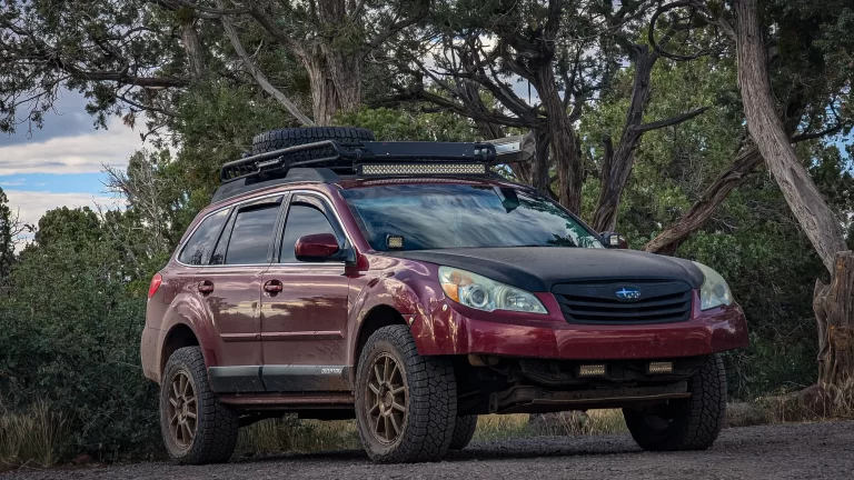 red subaru outback lifted outside